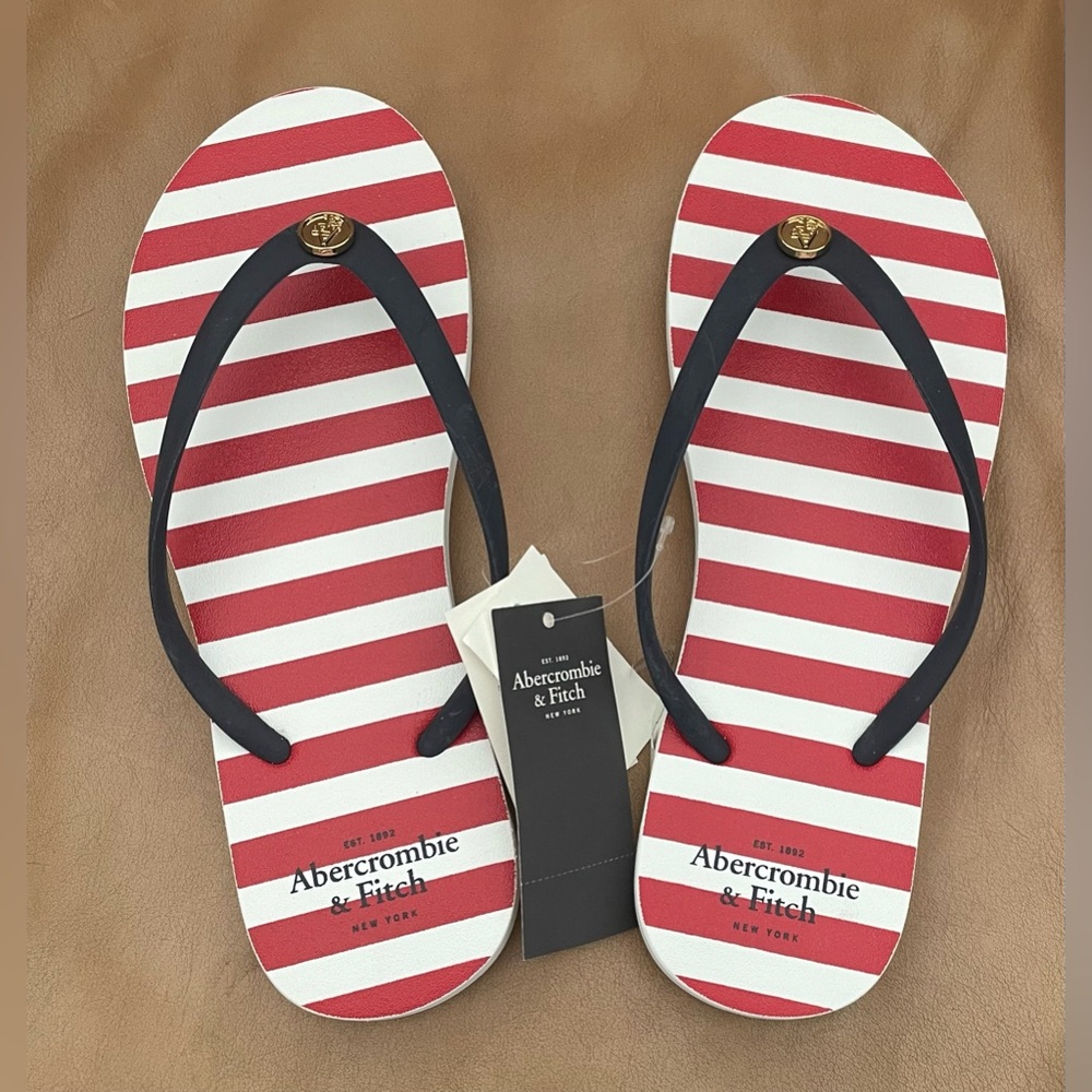 Abercrombie & Fitch flip flops
Color: Red / White / Blue * Size: 6/7
NWT